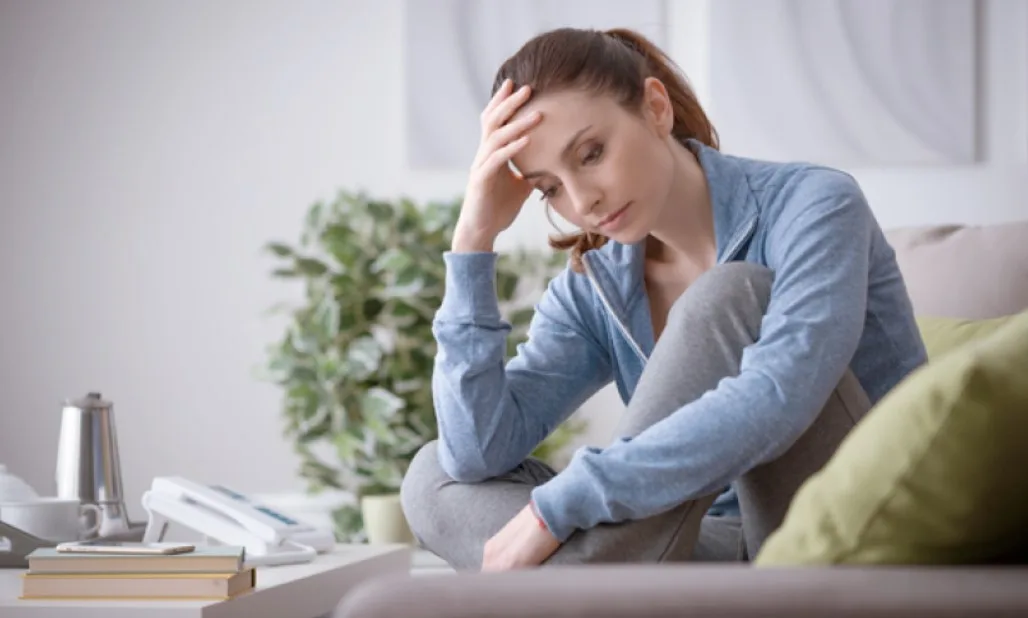 woman sitting thoughtfully