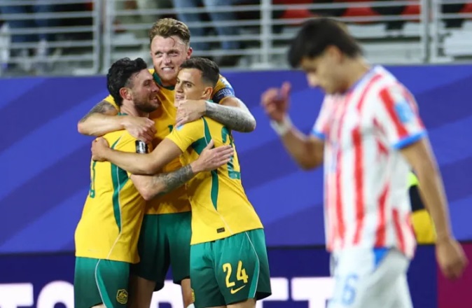 Australia’s Harry Souttar, Aiden O’Neill and Paul Okon-Engstler celebrate after the match