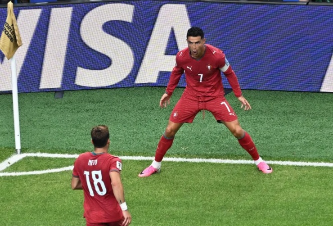 Portugal's Cristiano Ronaldo celebrated in his signature style after scoring against Uzbekistan
